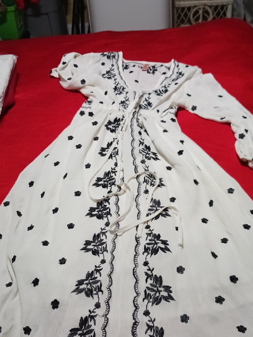 White Embroidered V-Neck Women’s Top with Black Floral Detailing